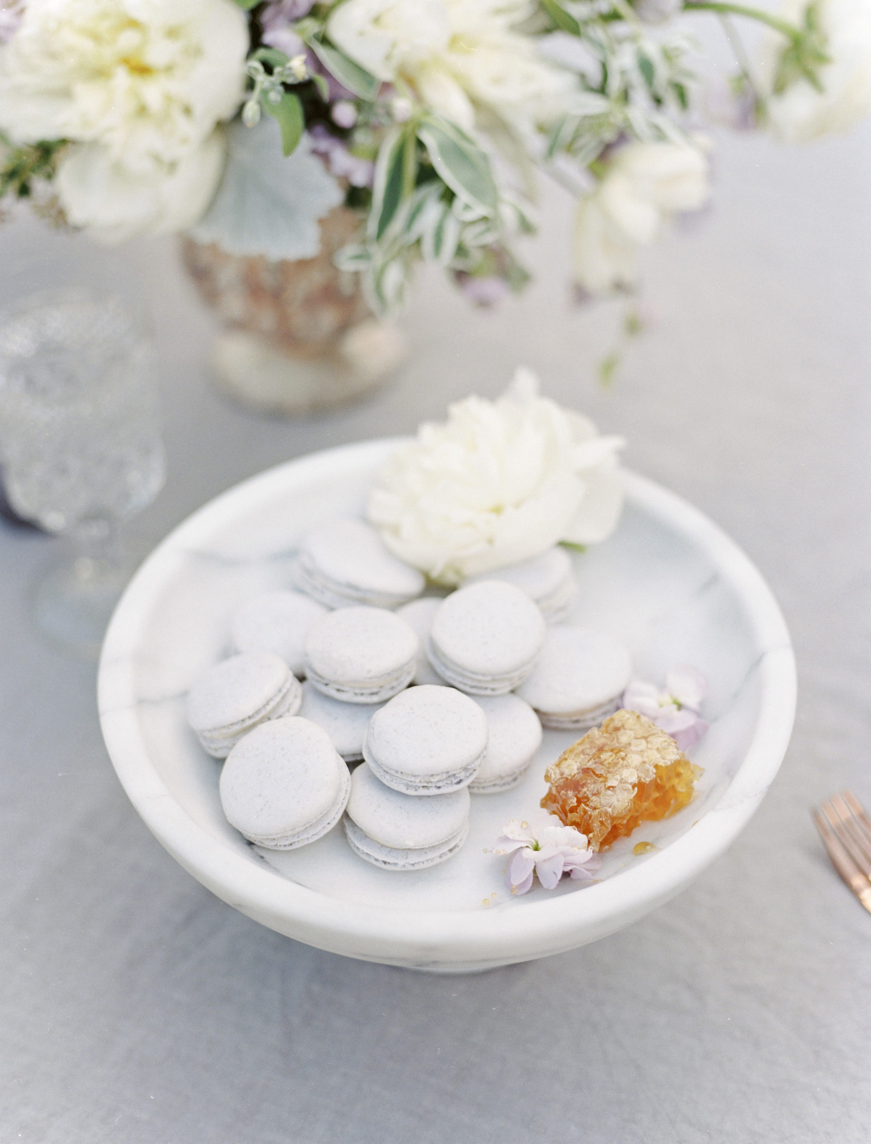 lavender macaroons in a marble dish at a lavender and copper wedding