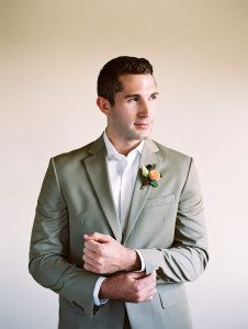 Pottery inspired wedding featuring a groom in a grey suit