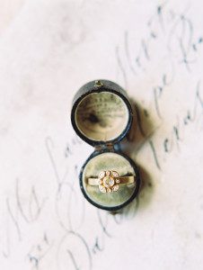 Pottery inspired wedding featuring a ring in a round vintage box