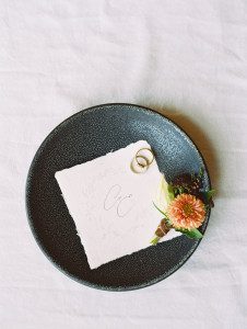 Pottery inspired wedding featuring clay dishes with rings