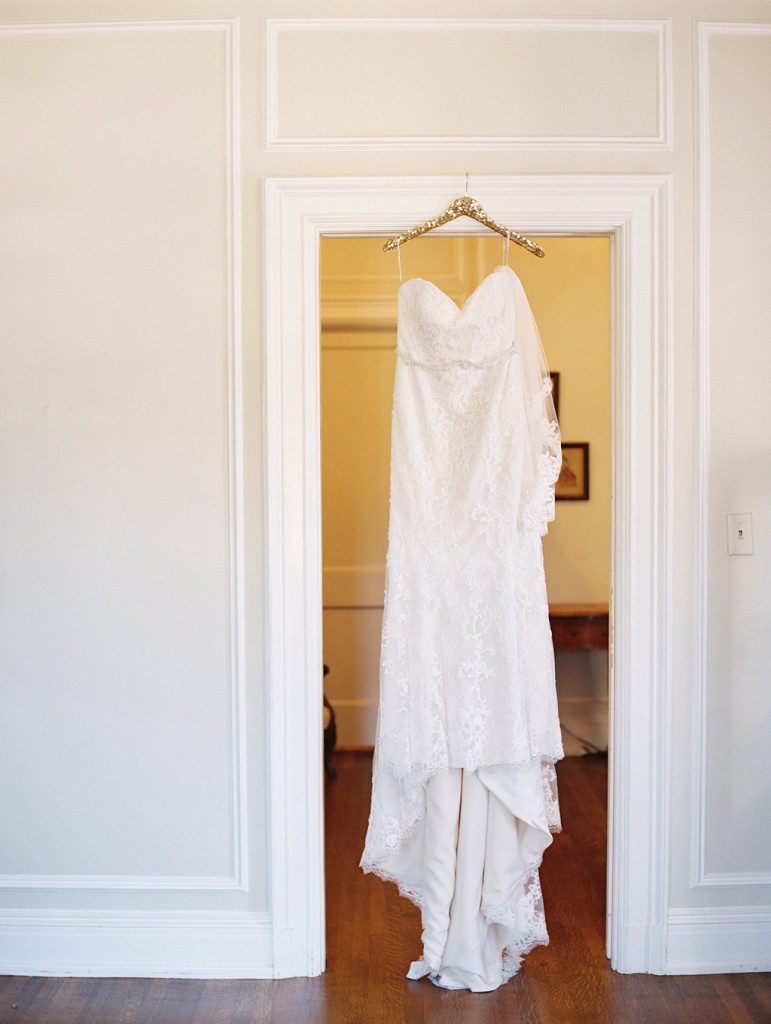 Bridal gown on hanger at a Dallas outdoor elopement