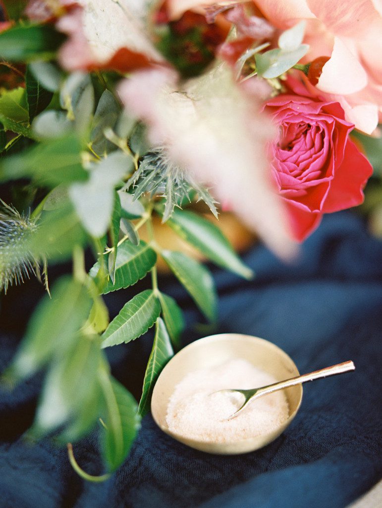 Brass salt cellar with pink salt and spoon at a Dallas outdoor elopement