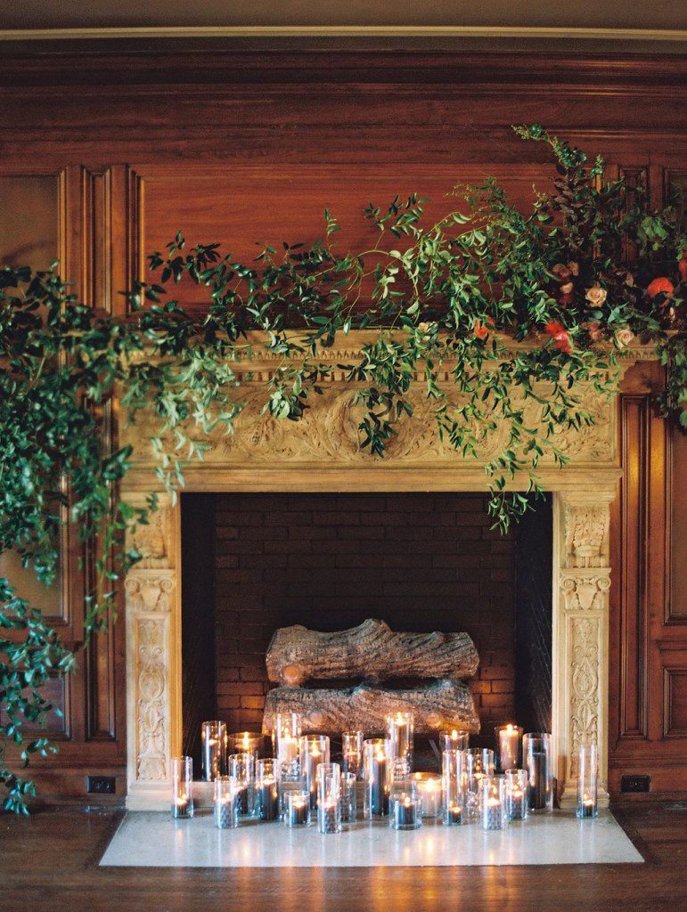 Floral and greenery styled on a fireplace at a Dallas outdoor elopement