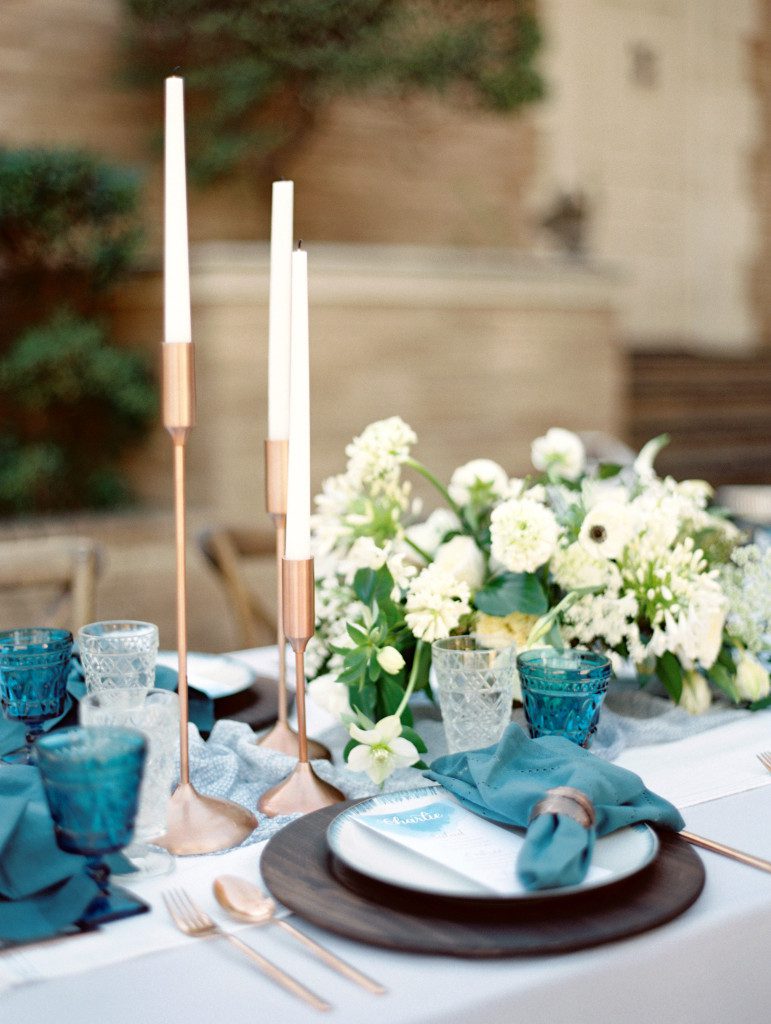 Blue table setting with copper candle holders  at a Dallas elopement at the Aldredge House