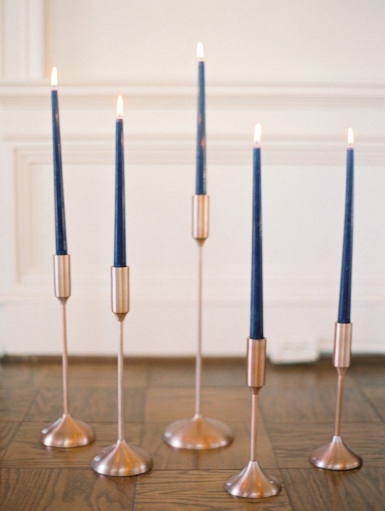 Navy taper candles in gold candleholders  at a Dallas elopement at the Aldredge House