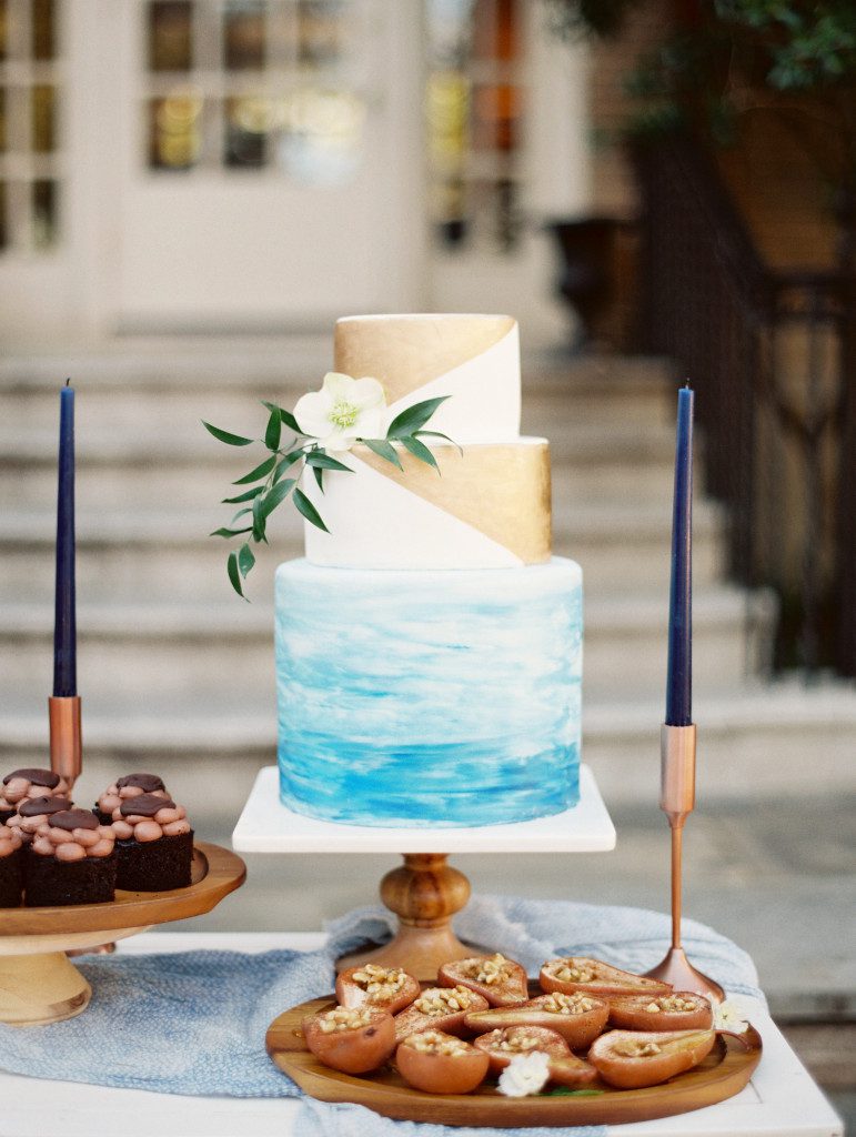 Wedding cake with the base layer in a blue watercolor wash. Top layers are dipped in edible gold.  at a Dallas elopement at the Aldredge House
