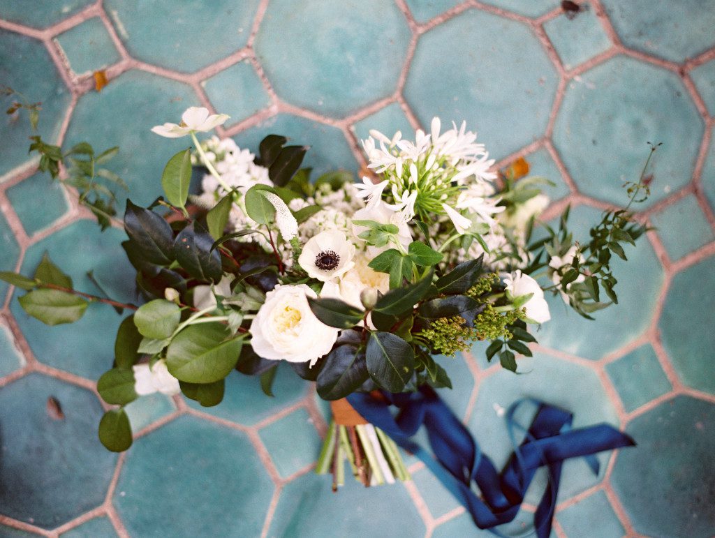 White bouquet tied with a navy ribbon at a Dallas elopement at the Aldredge House