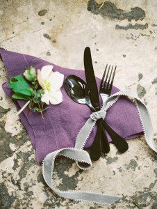 Black flatware tied with a ribbon
