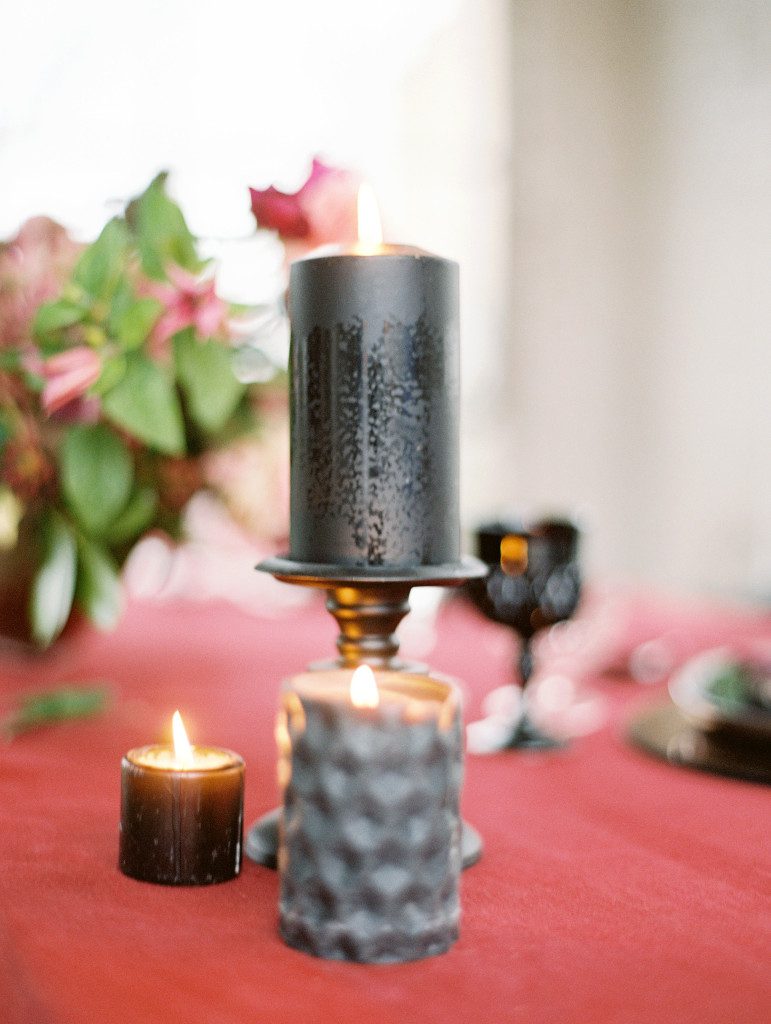 Black pillar candle on marsala linen Pantone color of the year 2015