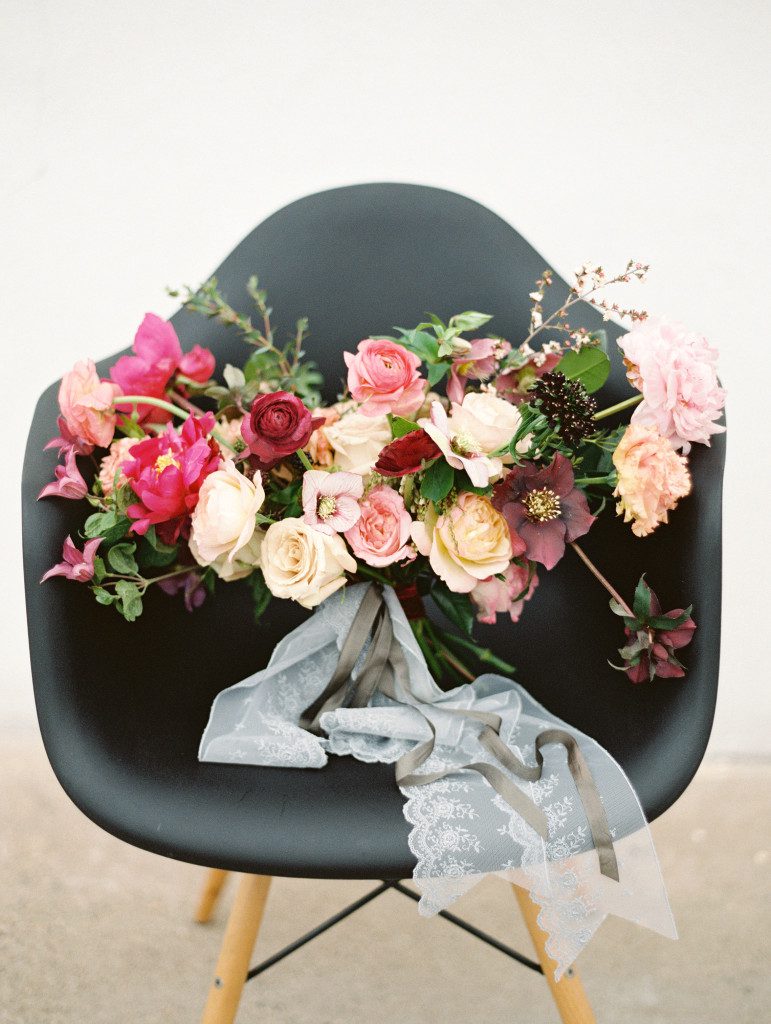 Marsala themed wedding bouquet displayed in black chair Pantone color of the year 2015