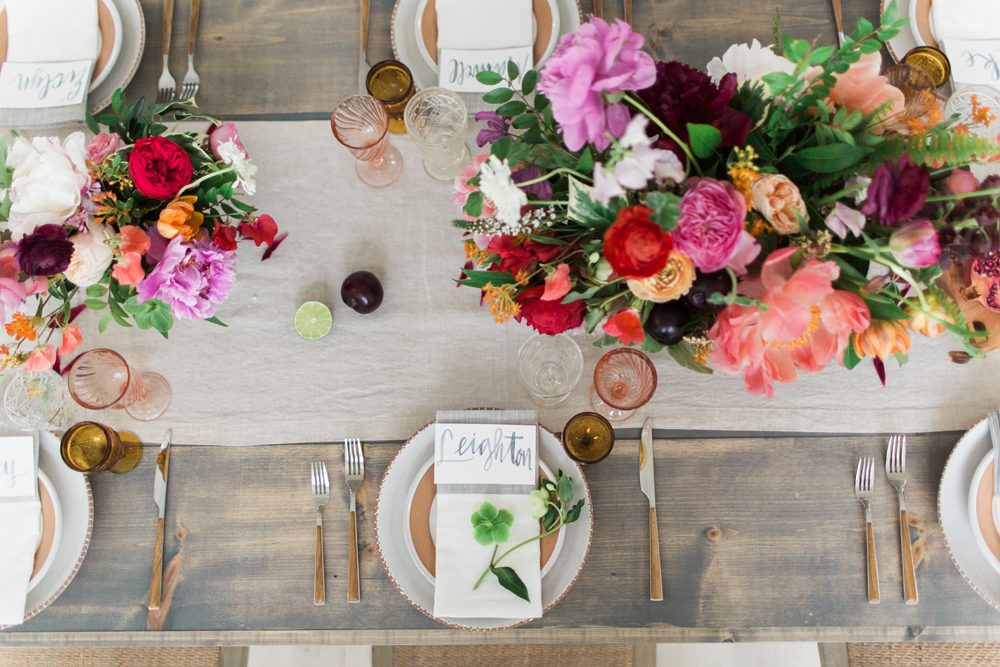 Brightly colored table design for rustic wedding