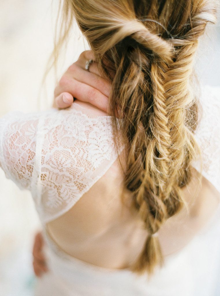 Loose fishtail braid wedding hairstyle by Kiss by Katie at a Mission San Jose wedding in San Antonio Texas