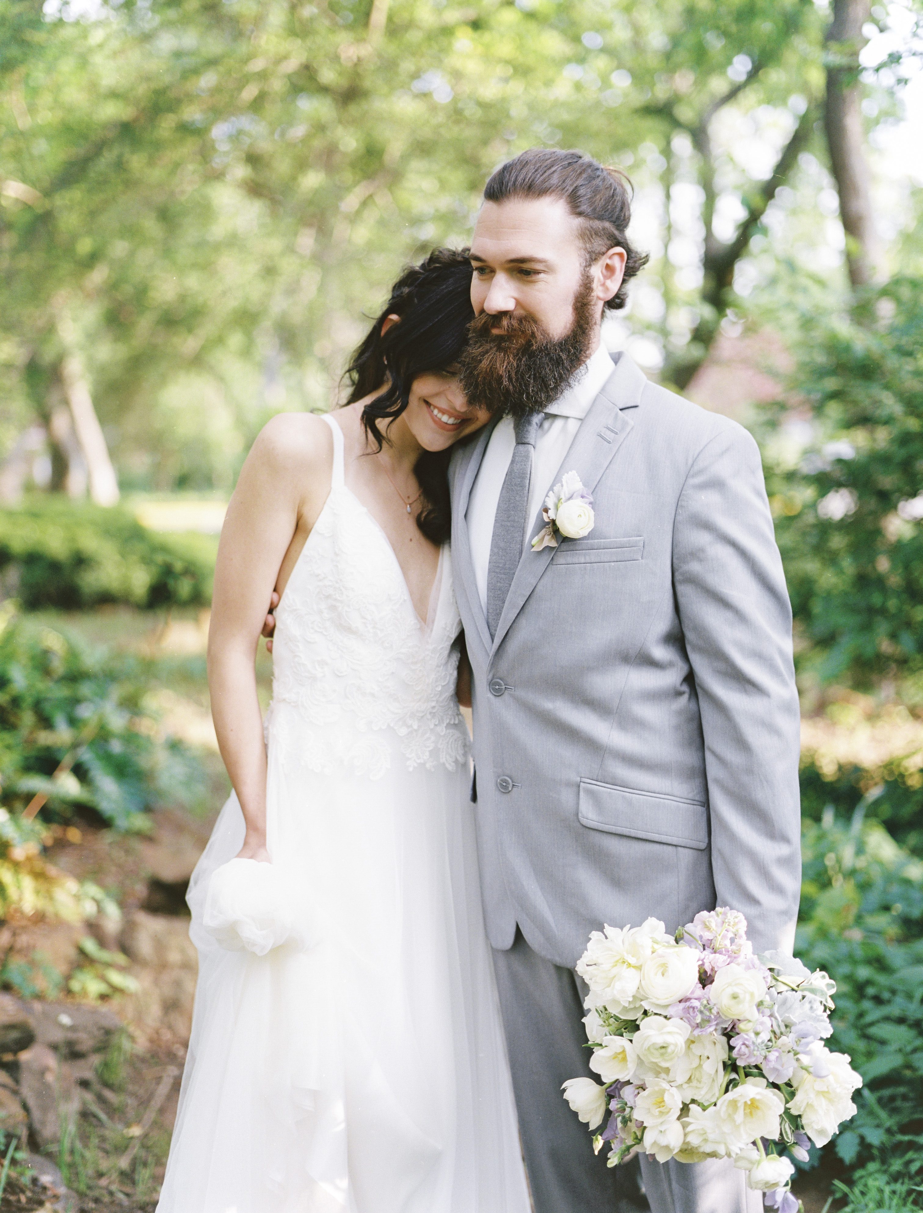 Bride and groom in a forest setting at a lavender and copper wedding