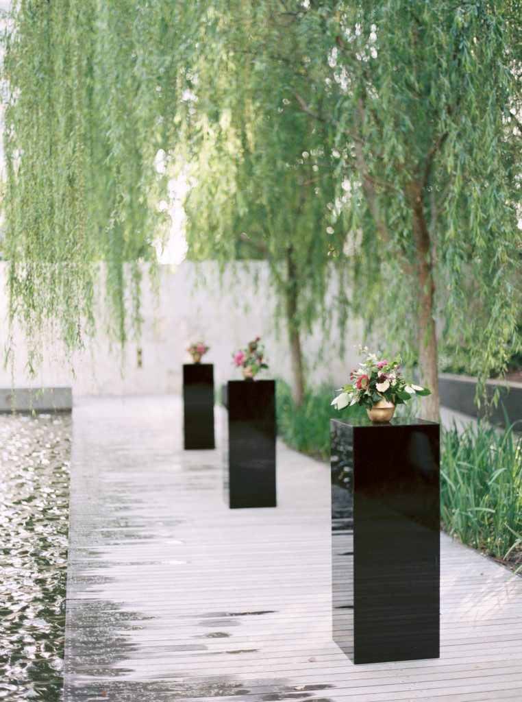 Black acrylic cocktail tables at a Nasher Sculpture Center wedding