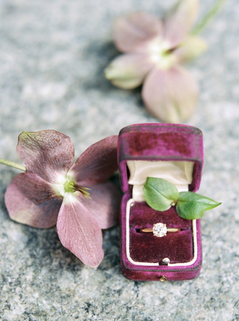 Diamond engagement ring styled in a vintage purple ring box at a Nasher Sculpture Center wedding