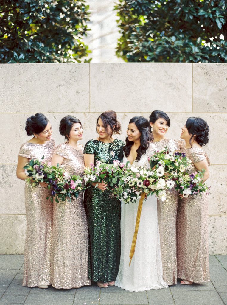 bridesmaids in gold and green sequin dresses at a Nasher Sculpture Center wedding