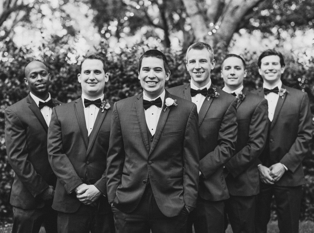 Groomsmen in black tuxedos with bow ties at a Nasher Sculpture Center wedding