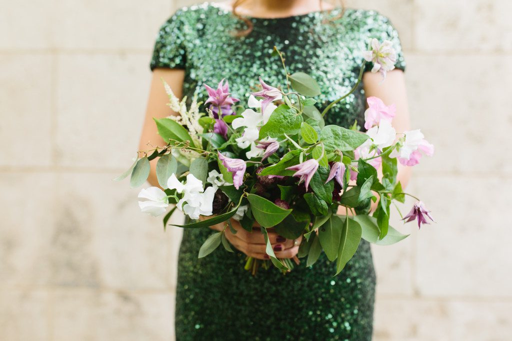 green bridesmaids bouquet with purple clematis at a Nasher Sculpture Center wedding