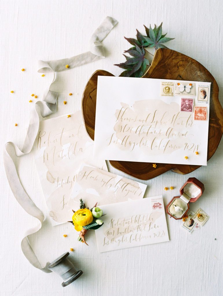 hand calligraphed wedding invitation styled